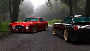 Elegant Row Of Parked Classic Cars Wallpaper