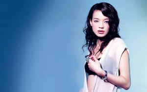 Elegant Shu Qi Posing For A Photoshoot Wallpaper