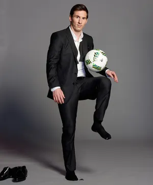 Elegant Soccer Player Suitand Ball Wallpaper