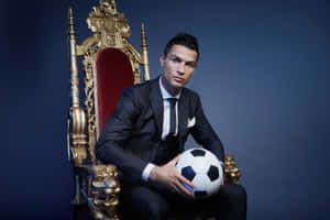 Elegant Soccer Star Seatedon Throne Wallpaper