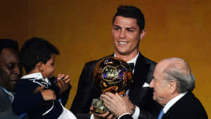 Elegant Soccer Starwith Golden Ball Trophy Wallpaper