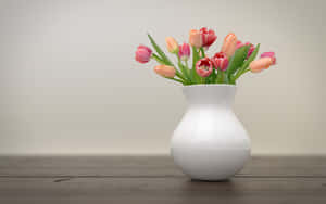 Elegant Tulipsin White Vase Wallpaper