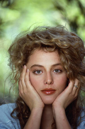 Elegant Virginia Madsen Posing For The Camera Wallpaper