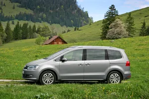 Elegant Volkswagen Sharan Gliding On The Road Wallpaper