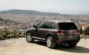 Elegant Volkswagen Touareg On An Open Road Wallpaper