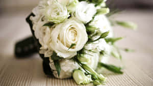 Elegant Wedding Bouquet In Bride's Hands Wallpaper