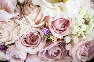 Elegant Wedding Bouquet In Bride's Hands Wallpaper