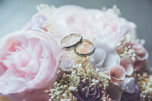 Elegant Wedding Bouquet In Bride's Hands Wallpaper