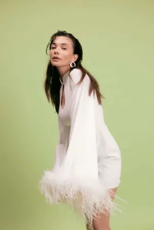 Elegant White Dress Green Backdrop Wallpaper