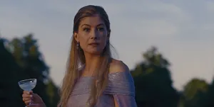 Elegant Woman Holding Cocktailat Dusk Wallpaper