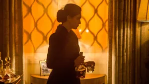 Elegant Woman Holding Decanter4 K Wallpaper