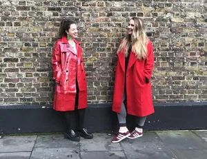 Elegant Woman In A Stunning Red Coat Wallpaper