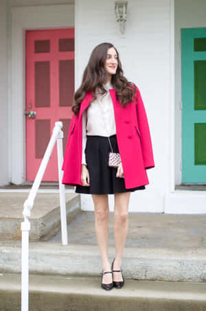 Elegant Woman In A Stylish Pink Coat Wallpaper