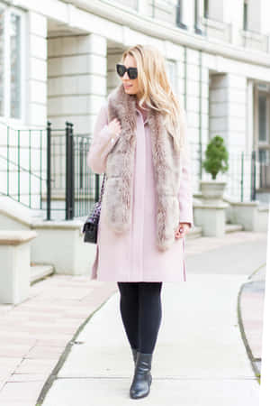 Elegant Woman In A Stylish Pink Coat Wallpaper