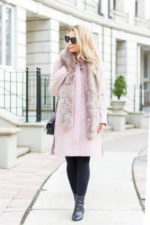 Elegant Woman In A Stylish Pink Coat Wallpaper