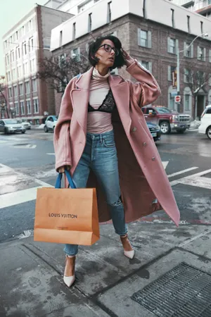 Elegant Woman In Fashionable Pink Coat Wallpaper