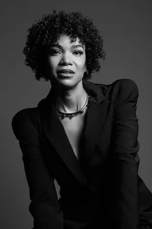 Elegant Woman In Monochrome Attire Wallpaper