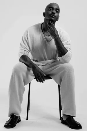 Elegant Woman In Monochrome Outfit Wallpaper