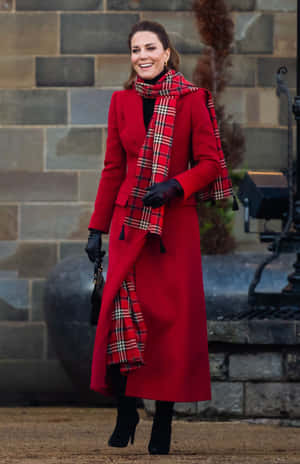 Elegant Woman In Vibrant Red Coat Wallpaper