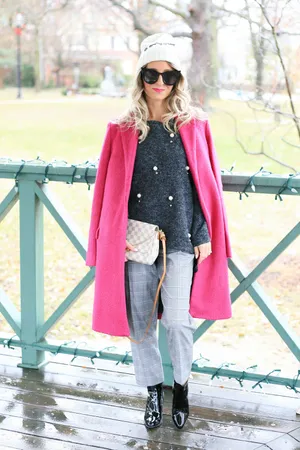 Elegant Woman Wearing A Pink Coat Wallpaper