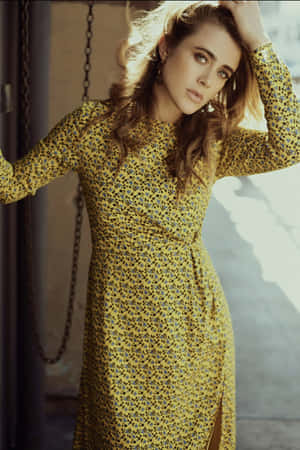 Elegant Woman Yellow Floral Dress Wallpaper