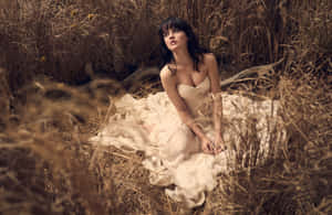 Elegant Womanin Golden Field Wallpaper