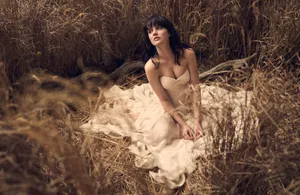 Elegant Womanin Golden Field Wallpaper