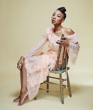 Elegant Womanin Peach Dress Wallpaper