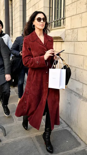 Elegant Womanin Red Coatand Black Boots Walkingon Street4 K Wallpaper