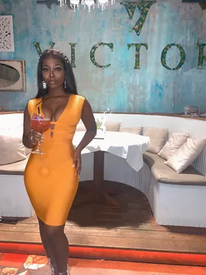 Elegant Womanin Yellow Dressat Luxury Venue.jpg Wallpaper