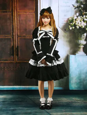 Elegant Young Lady Dressed In Classic Lolita Fashion Wallpaper