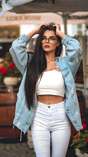 Elegant Young Woman Posing In Studio Wallpaper