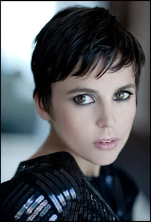 Elena Anaya Posing Against A Pink Background Wallpaper