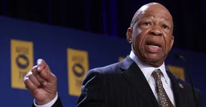 Elijah Cummings Speaking In Front Of Blue Backdrop Wallpaper