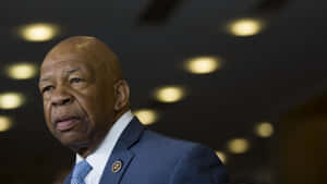 Elijah Cummings With A Black Backdrop With Lights Wallpaper