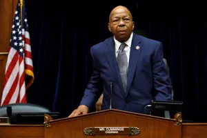 Elijah Cummings With American Flag And Black Backdrop Wallpaper