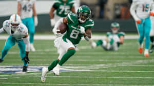 Elijah Moore In Action Against Dolphins Wallpaper