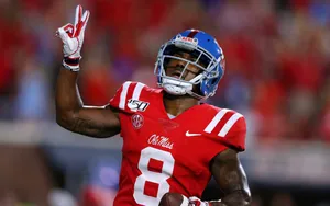 Elijah Moore Ole Miss Football Action Wallpaper