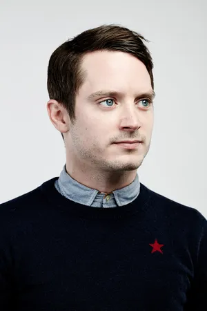 Elijah Wood In Crew Neck Sweater Wallpaper