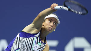 Elise Mertens Delivering A Tennis Stroke Wallpaper