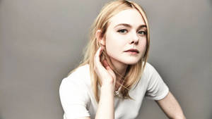 Elle Fanning Waving Her Hair Wallpaper