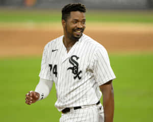 Eloy Jimenez Showing His Powerful Swing At A Baseball Game. Wallpaper