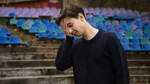 Embarrassed Man Facepalm Stadium Seats Wallpaper