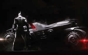 Emblazoned With A Fierce Impact, The Batmobile Roars Down The Street Ready For Battle. Wallpaper