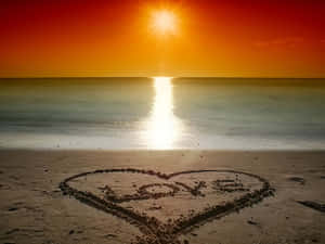 Embrace The Romantic Sunset On The Beach Wallpaper