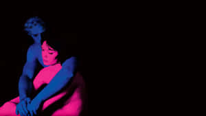 Embracing Figures Neon Contrast Art Wallpaper