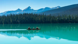 Emerald Lake Canoeing Adventure Wallpaper