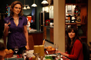 Emily And Zooey Deschanel In Bones Dinner Wallpaper