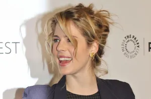 Emily Bett Rickards Smiling Event Appearance Wallpaper