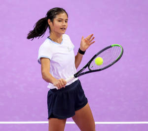 Emma Raducanu On The Court In A Pink Outfit Wallpaper